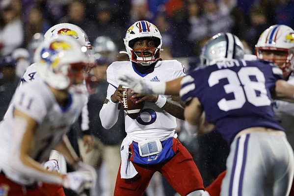 Kansas quarterback Jalon Daniels (6)looks for a receiver during the second quarter of an NCAA college football game against Kansas State on Saturday, Nov. 26, 2022, in Manhattan, Kan. (AP Photo/Colin E. Braley)