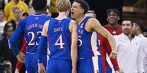 Kansas' Kevin McCuller Jr. (front right) after a 3-point basket by Grady Dick (4) during the first half of the NCAA college basketball game against Missouri in Columbia, Missouri, Saturday, Dec. 10, 2022. Celebrating (AP Photo/LG Patterson)